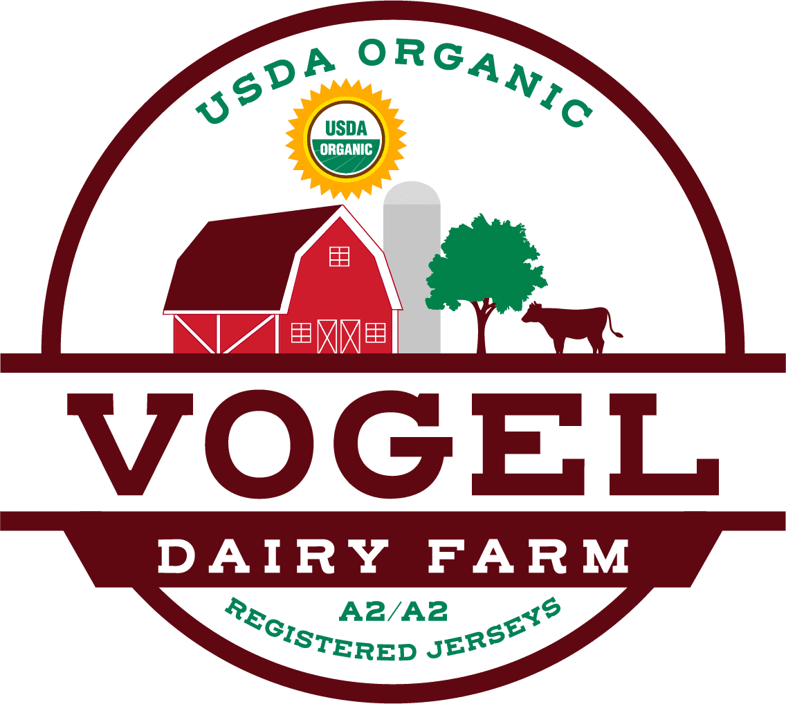 A logo of a dairy farm with a barn and cow.